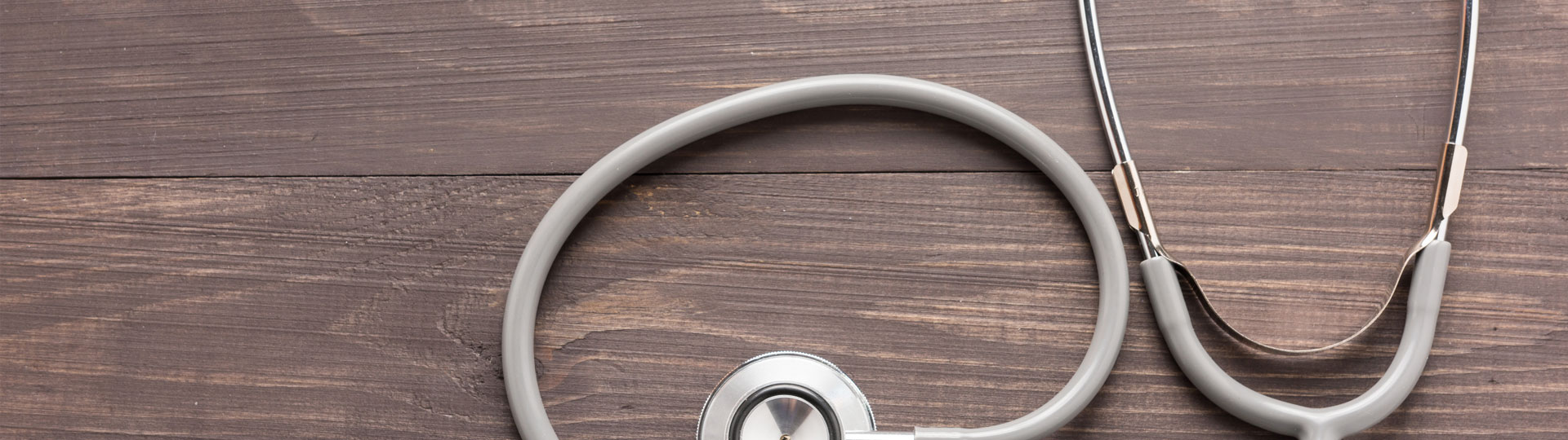Stethoscope on wooden table